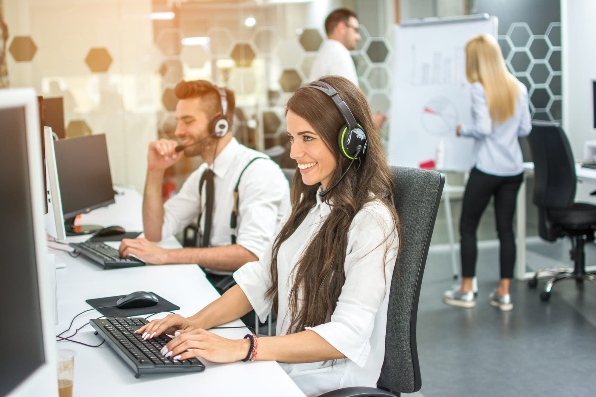 Friendly call centre agent with headset ready to assist